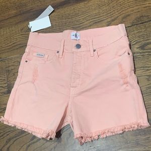CK light pink distressed shorts